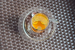 Tangerine tea on a table in a cafe