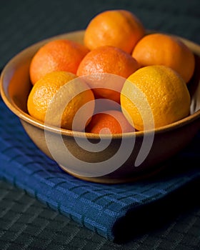 Tangerines In Bowl on Blue Placemat