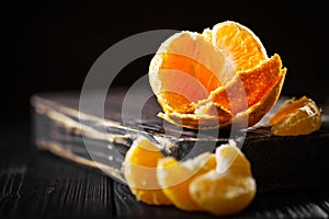 Tangerines on an old fashioned country table. Selective focus. Horizontal.