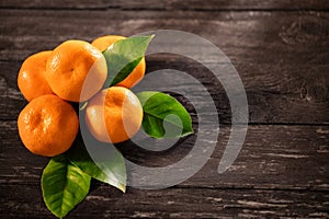 Tangerines top view on a wooden background- Mandarins