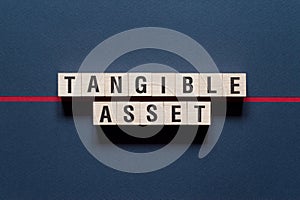 Tangible asset word concept on cubes