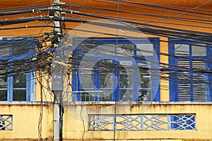 A tangle of cables and wires on front of window