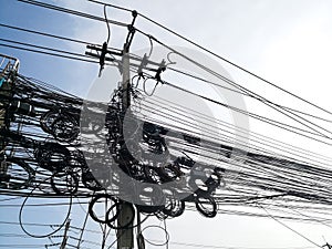 Tangle of Electrical cables and Communication wires on electric pole