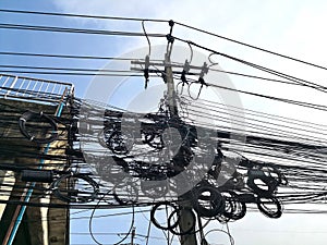 Tangle of Electrical cables and Communication wires on electric pole