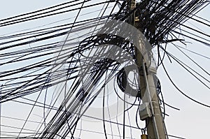 Tangle of Electrical Wires on Power Pole photo