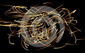 A tangle of fiery glowing lines.Flying fire sparks. Abstract background