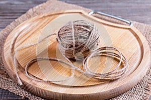 Tangle of thread on a wooden board