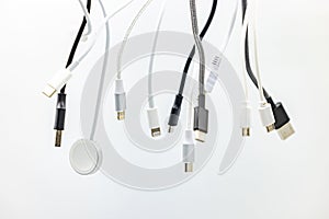 A mess of plugs and USB cables cropped in studio