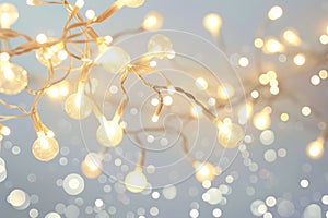 A tangle of white string lights shines brightly