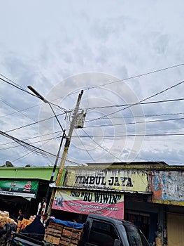 Tangled cables of electricities between grocery store