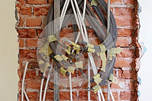 Tangled electrical conduits and cables.