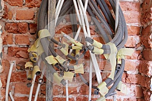 Tangled electrical conduits and cables.