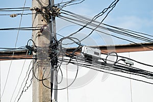 Tangled Electrical Wire on Electricity Post