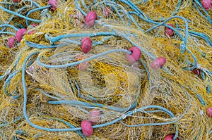 Tangled fishing nets and floats close-up on the shore