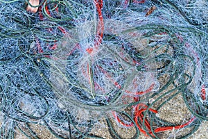 Tangled fouled blue used fishing nets photo