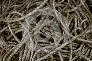 Tangled inextricable skein of long linen rope