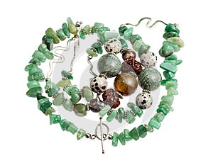 Tangled necklace from green aventurine isolated