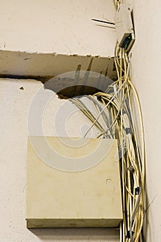 Tangled network cables and wires in server room