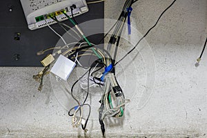 Tangled network cables and wires in server room