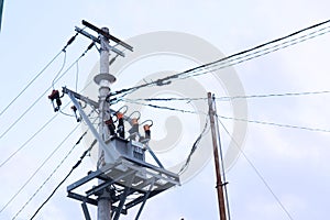 Tangled wire on electric tower with blue sky view