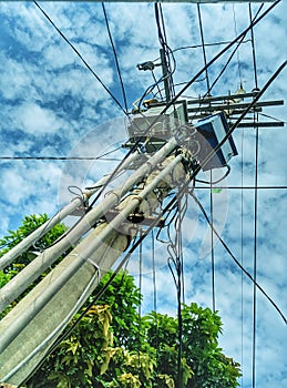 Tangled wires at electric tower in the morning