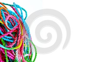 Tangled yarn, tangled colorful sewing threads on white