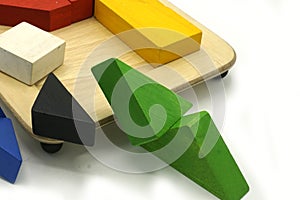 Tangram, Chinese traditional puzzle game made of different colorful wooden pieces that come together in a distinct shape