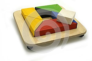 Tangram, Chinese traditional puzzle game made of different colorful wooden pieces that come together in a distinct shape