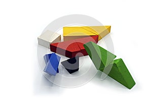 Tangram, Chinese traditional puzzle game made of different colorful wooden pieces that come together in a distinct shape