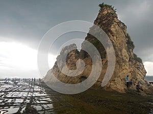 Tanjung layar rock when the sea water recedes, Sawarna beach Banten