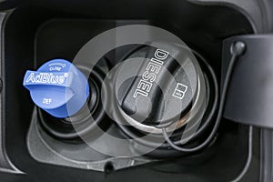 Tank filler neck for AdBlue and Diesel fuel close-up. Adblue diesel exhaust fluid fuel tank cap.