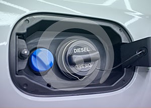 Tank filler neck for AdBlue and Diesel fuel close-up. Adblue diesel exhaust fluid fuel tank cap.