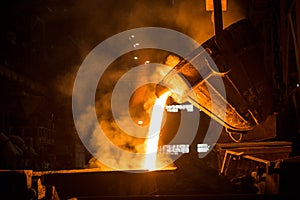 Tank pours liquid metal in the molds at the steel mill