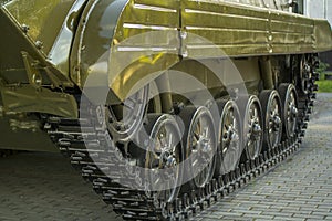 Tank track, standing by the tracks on the pavement