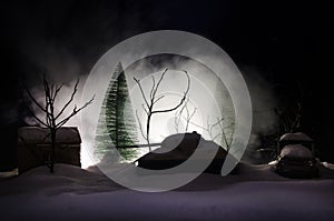 Tank under the snow at night in forest at conflict zone. Silhouette of military tank. War military concept idea