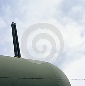 Tanker Behind Barberd Wire