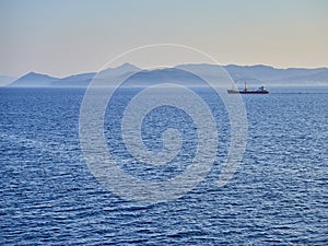 A Tanker crossing the Aegean sea with Greek coasts in background.