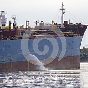 Tanker discharging ballast into the harbor