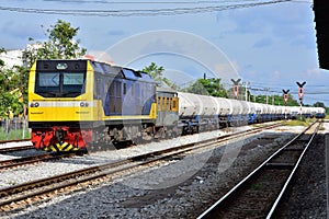 Tanker-freight train by diesel locomotive on the railway yard