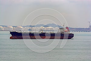 Tanker in front of an oil storage terminal