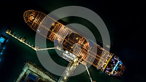 Tanker ship at the port, Oil terminal tanker ship loading at night, Aerial view