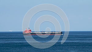 Tanker ship sails in the sea. Side view of the oil tanker