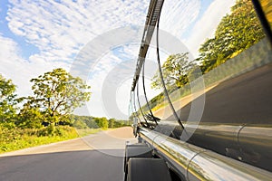 Tanker truck with reflection of tree