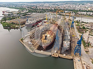 Tanker vessel repair in dry dock Shipyard, aerial view