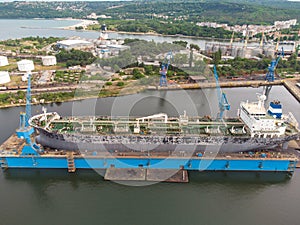 Tanker vessel repair in dry dock Shipyard, aerial view