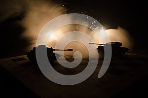 Tanks in the conflict zone. The war in the countryside. Tank silhouette at night. Battle scene.