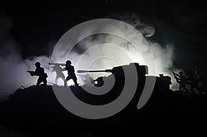 Tanks in the conflict zone. The war in the countryside. Tank silhouette at night. Battle scene.