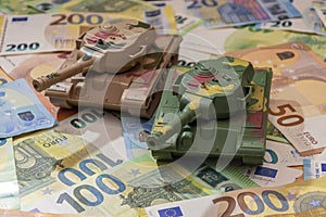 Tanks are on euro bills. Concept: military and financial assistance to Ukraine