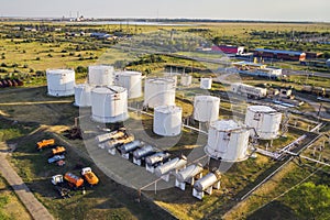 Tanks with petroleum products are among the fields near the village. The view from the top. aerial view. Fuel Storage Tank