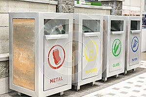 Tanks for sorting garbage. Different colored trash recycling container ecology concept